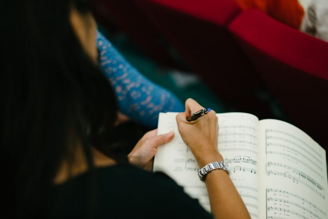 Taking notes during Qatar Concert Choir rehearsal